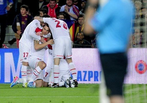Paris Saint Germain's players celebrate a goal at Camp Nou stadium in Barcelona on April 10, 2013